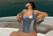 Kylie Jenner Sunbathes on a Boat in a Sexy Silver Swimsuit: ‘Lake Life’